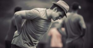 slip disc treatment in indore showing lower back pain radiating to legs and nerve compression